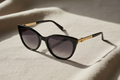 Luxury women's cat-eye black and gold sunglasses